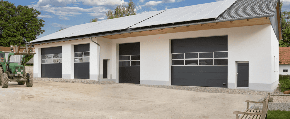 Many OSP42A Industrial doors with framed sections in anthracite